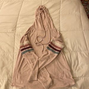 Light pink hoodie with four stripes on sleeves